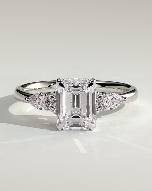 Raleigh - Emerald Claw Solitaire with Pear Accents and Round Shoulder Stones Engagement Ring - Platinum