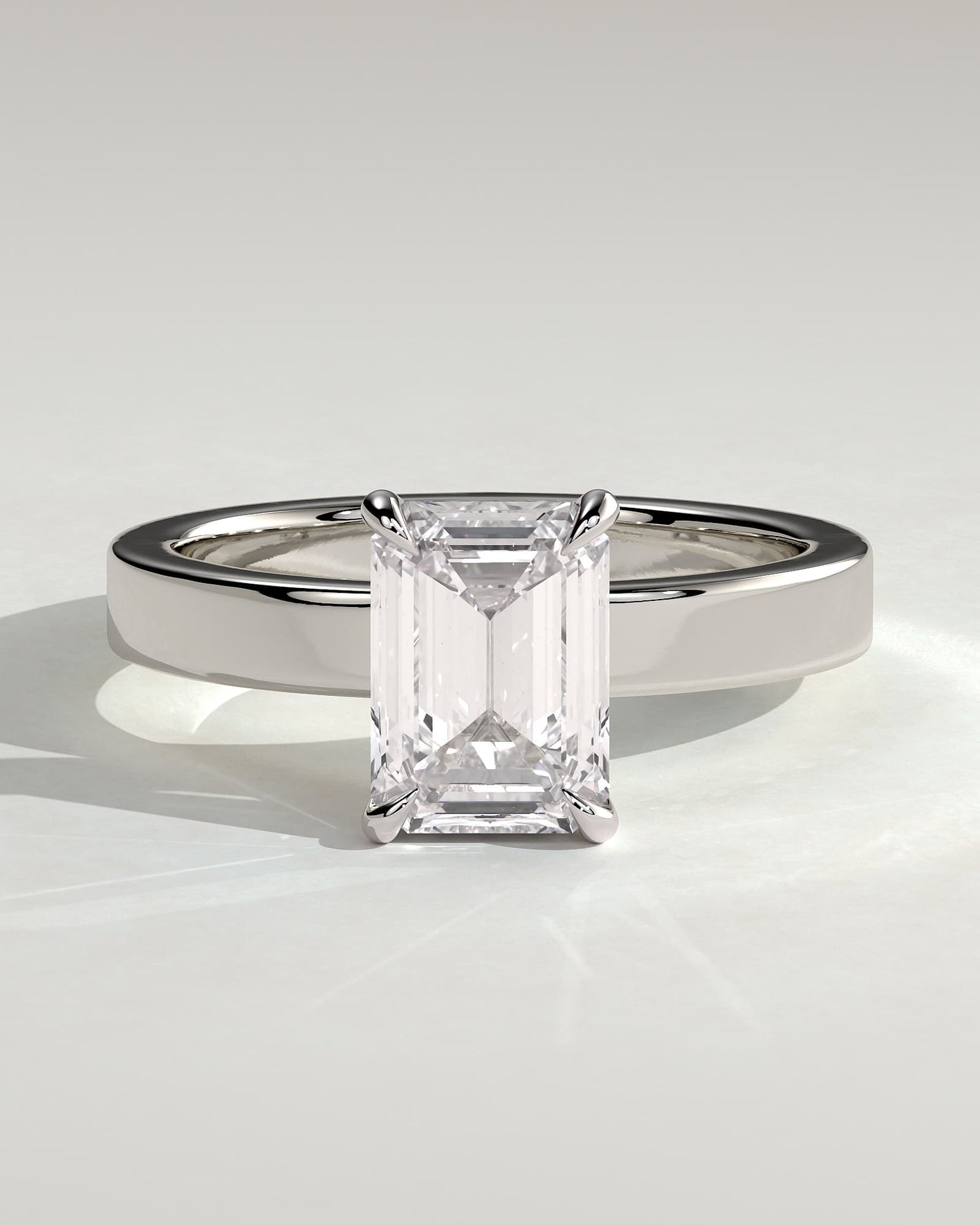 Carmella - Emerald Claw Solitaire with Flat Cigar Band and Hidden Halo Engagement Ring - White Gold