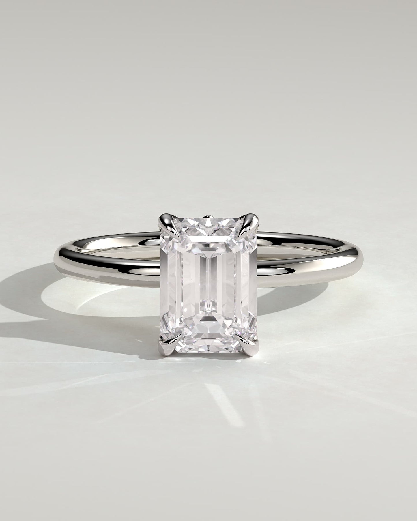Dove - Emerald Claw Solitaire with Petal Gallery and Accent Leaf Detail Engagement Ring - White Gold