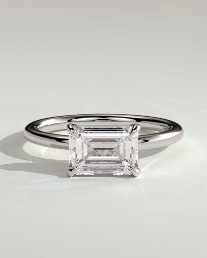 Debbie - Emerald East West Claw Solitaire Engagement Ring - Platinum