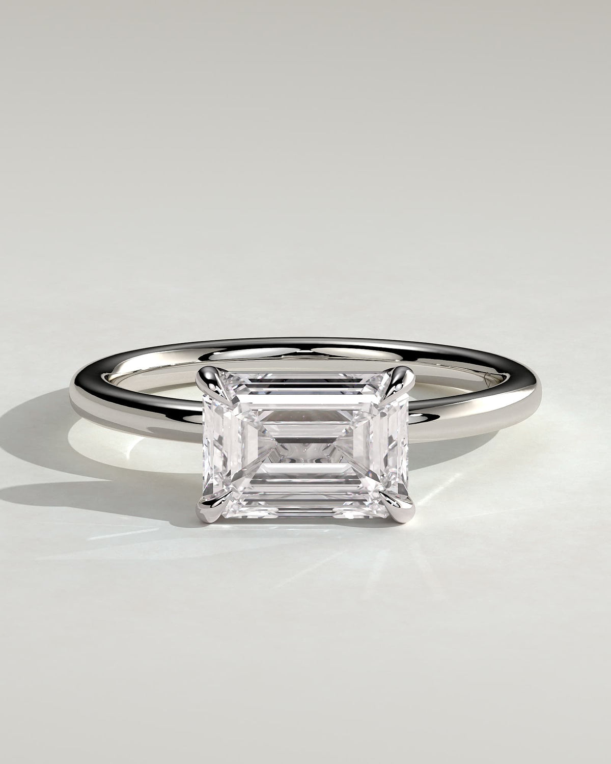 Debbie - Emerald East West Claw Solitaire Engagement Ring - White Gold