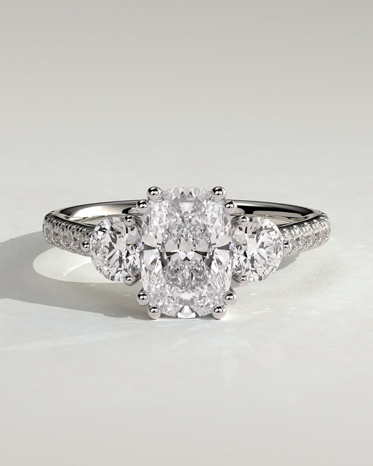 Meghan - Elongated Cushion Double Claw Trilogy with Round Side Stones, Pave Band and Cathedral Setting Engagement Ring - White Gold