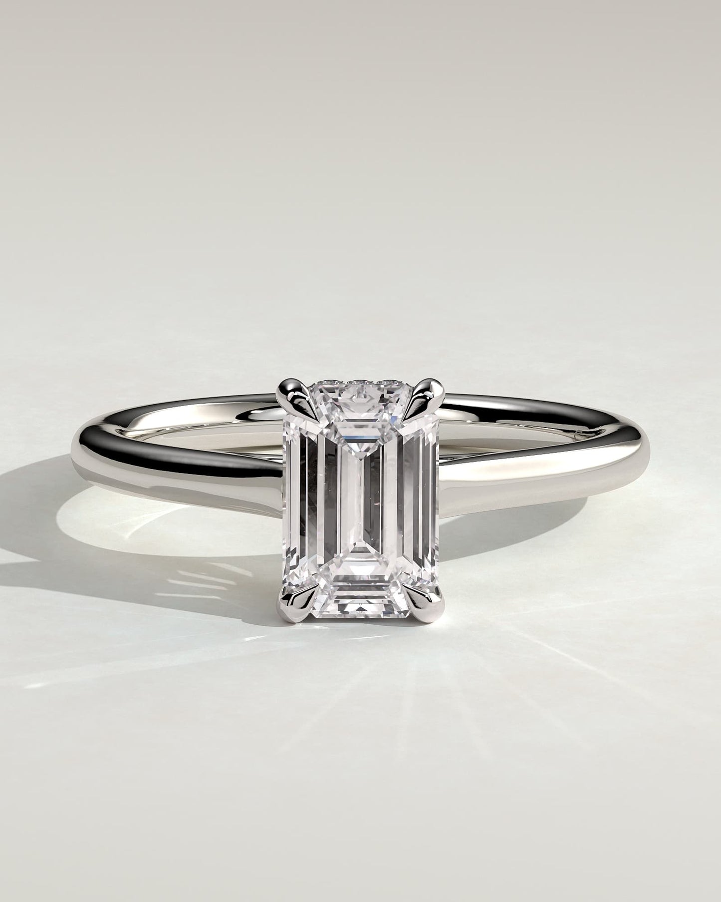 Jane - Emerald Claw Solitaire with Hidden Halo and Cathedral High Setting Engagement Ring - Platinum