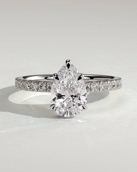 Jordanna - Pear Claw Solitaire with Wrap Around Hidden Halo and Pave Band Engagement Ring - Platinum