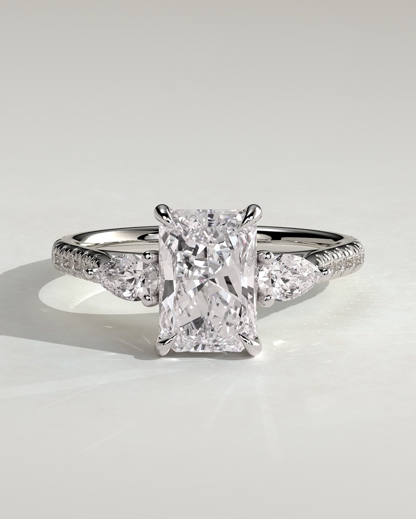 Ginny - Radiant Claw Trilogy with Pear Side Stones and Pave Band Engagement Ring - White Gold