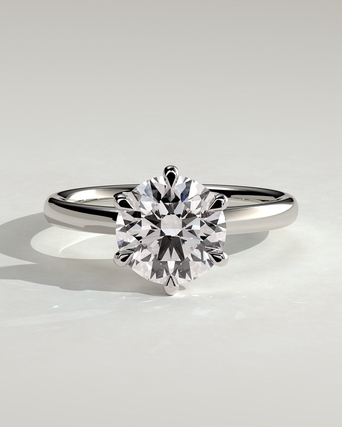Daniela - Round Claw Solitaire with Solid Cathedral High Setting Engagement Ring - White Gold