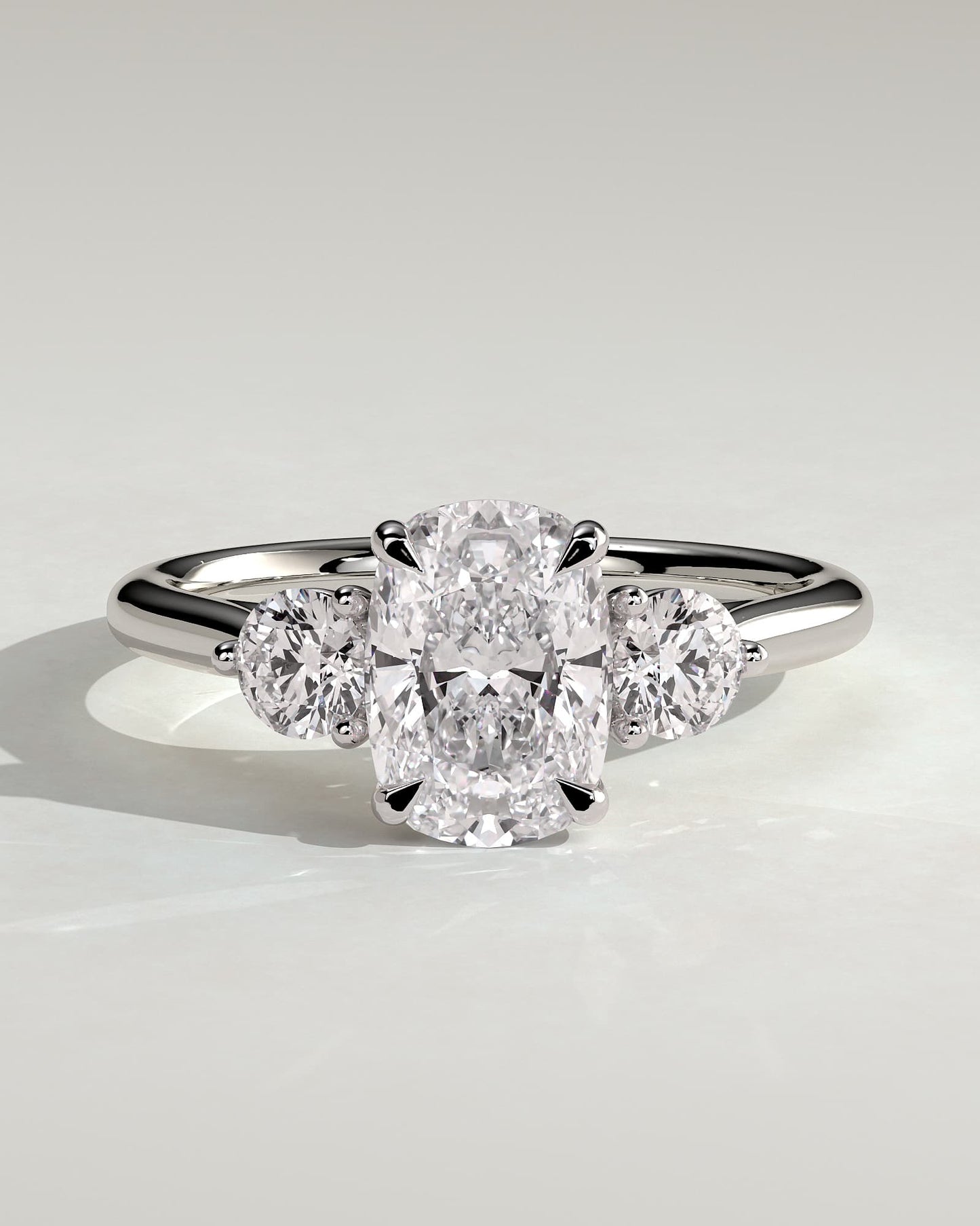 Charmaine - Elongated Cushion Claw Trilogy with Round Side Stones and Lily Detail Engagement Ring - White Gold