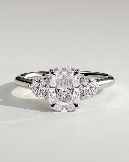 Charmaine - Elongated Cushion Claw Trilogy with Round Side Stones and Lily Detail Engagement Ring - White Gold