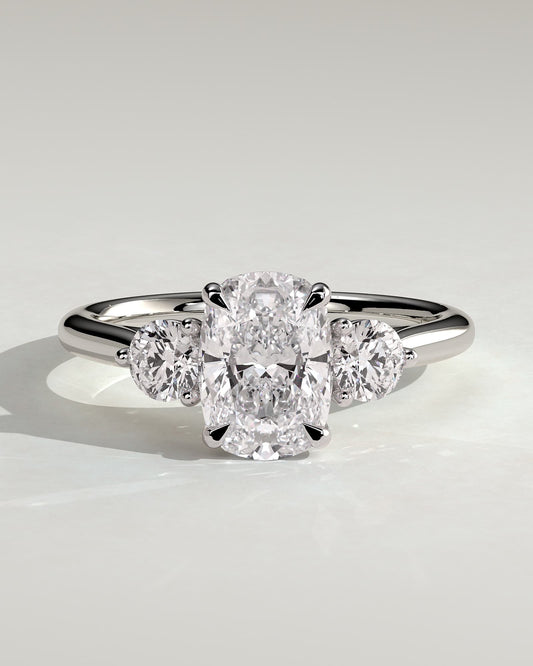 Charmaine - Elongated Cushion Claw Trilogy with Round Side Stones and Lily Detail Engagement Ring - White Gold