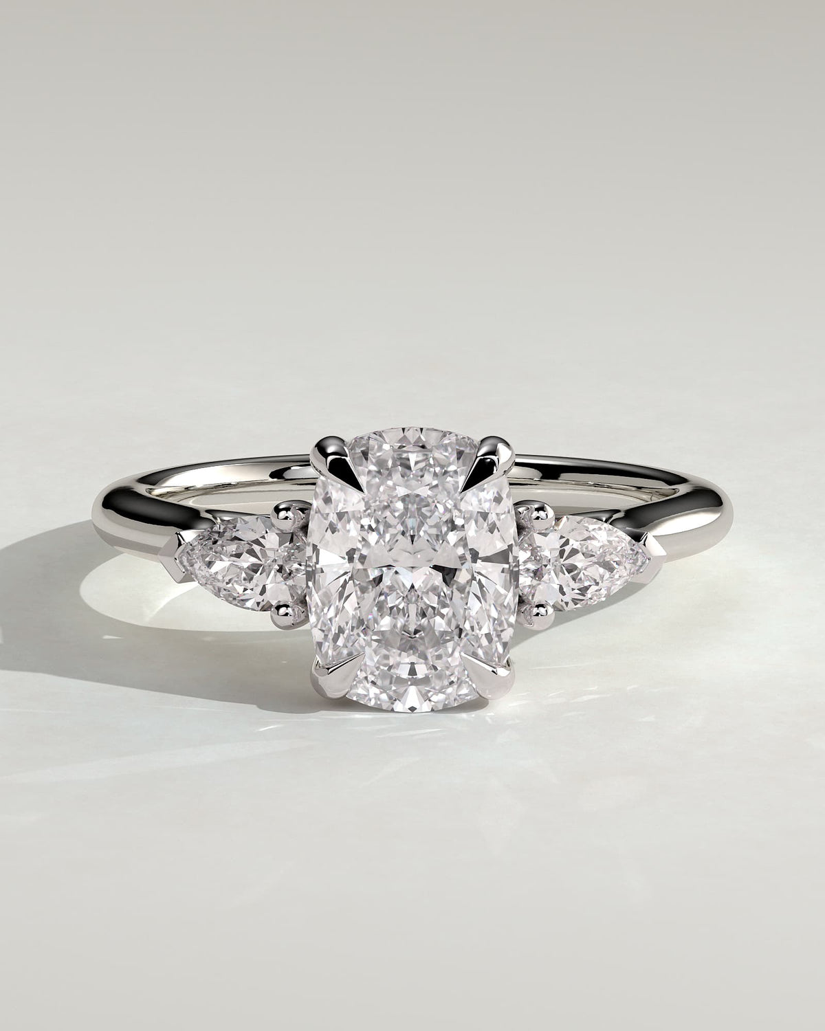Cataleya - Elongated Cushion Claw Trilogy with Pear Side Stones and Cathedral Setting Engagement Ring - White Gold
