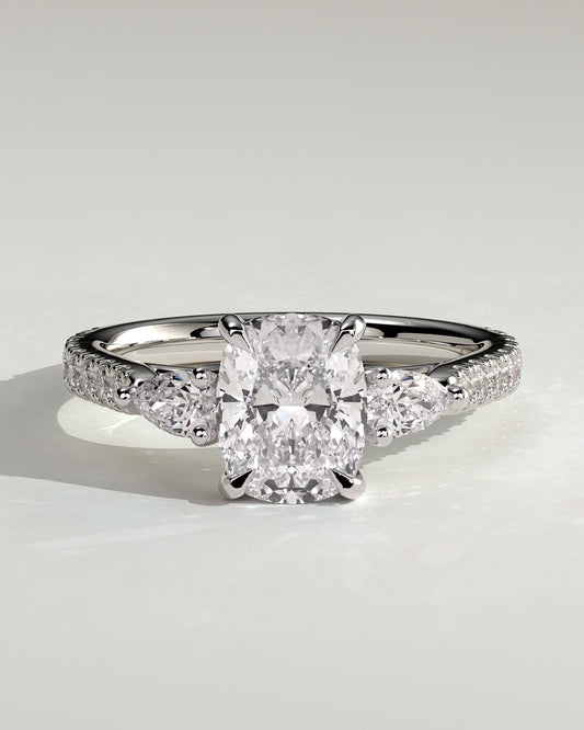 Bree - Elongated Cushion Claw Trilogy with Pear Side Stones and Pave Band Engagement Ring - Platinum