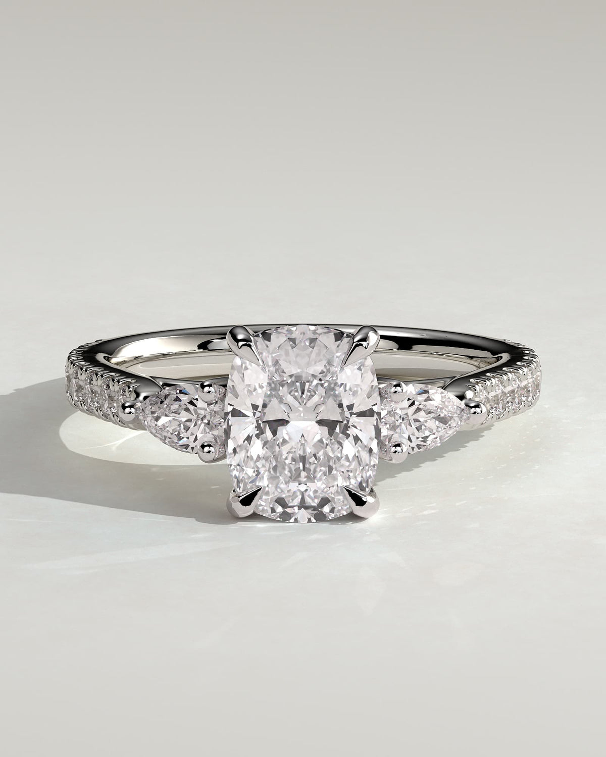 Bree - Elongated Cushion Claw Trilogy with Pear Side Stones and Pave Band Engagement Ring - White Gold