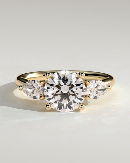 Adelyn - Round Claw Trilogy with Pear Side Stones and Open Trellis Gallery Engagement Ring - Yellow Gold