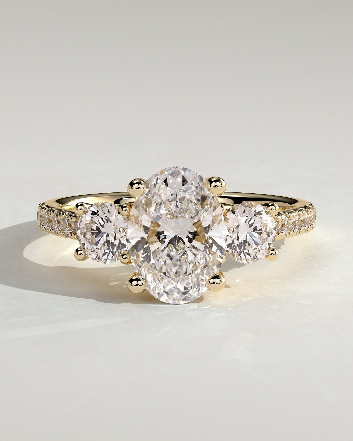 Aviana - Oval Claw Trilogy with Round Side Stones, Pave Band and Trellis Gallery  Engagement Ring - Yellow Gold - Yellow Gold 2ct