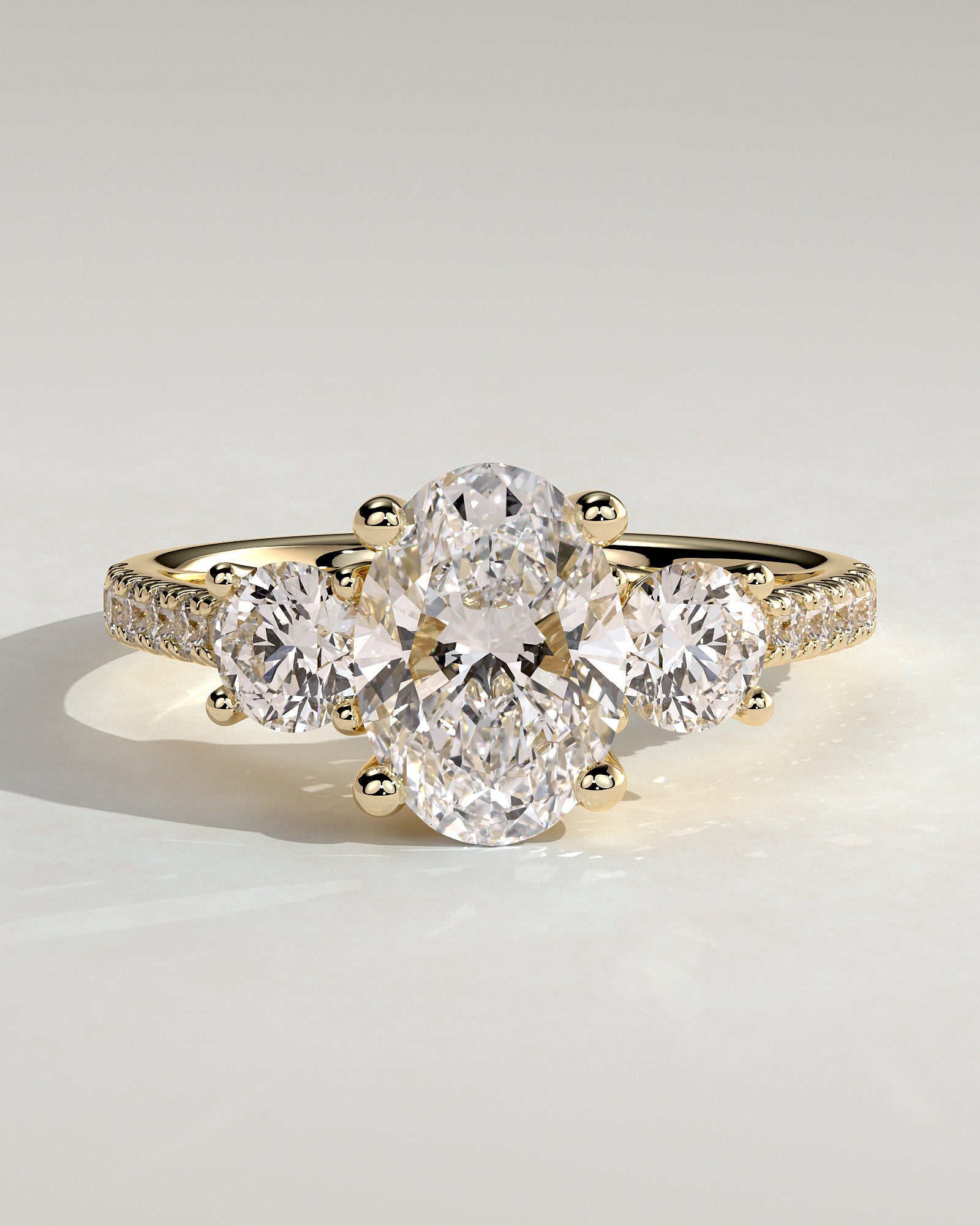 Aviana - Oval Claw Trilogy with Round Side Stones, Pave Band and Trellis Gallery  Engagement Ring - Yellow Gold - Yellow Gold 2ct