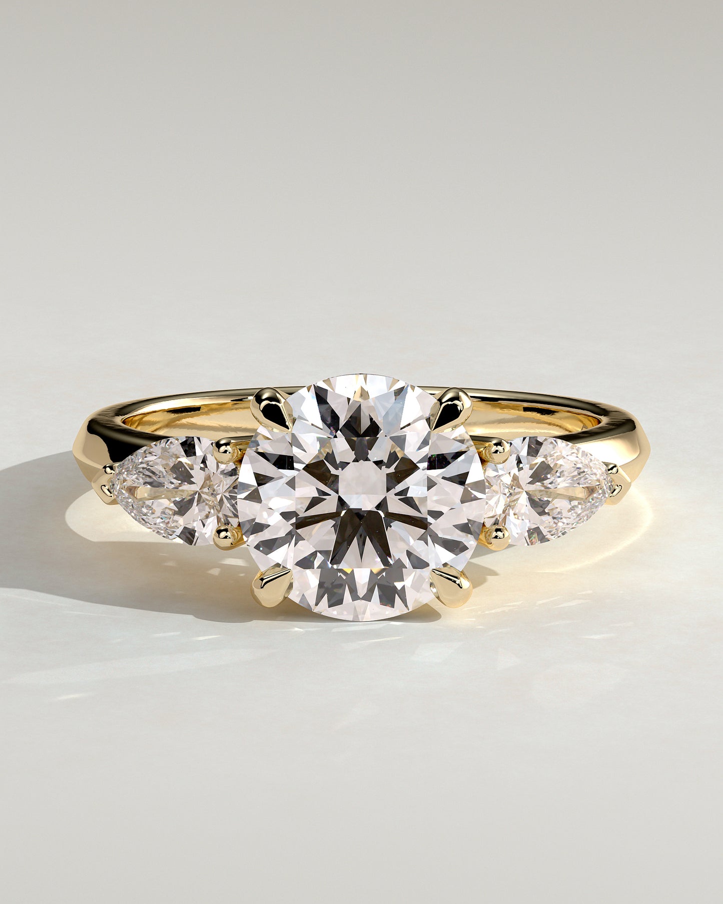 Halle - Round Claw Trilogy with Pear Side Stones and Knife Edge Band Engagement Ring - Yellow Gold - Yellow Gold 2ct