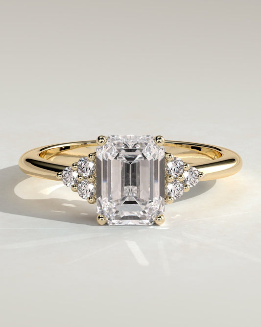 Martina - Emerald Claw Solitaire with Round Shoulder Stones Engagement Ring - Yellow Gold