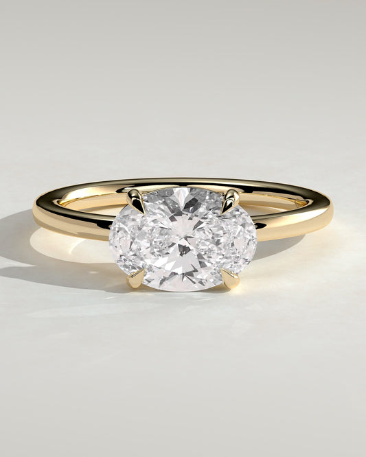 Mabeline - Oval East West Claw Solitaire with Raised Basket Gallery Engagement Ring - Yellow Gold