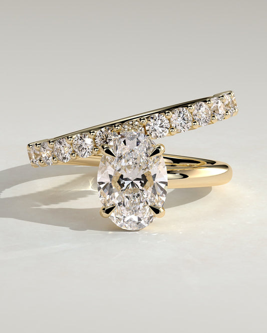 Sevela - Oval Claw Solitaire with Angled Pave Band-and-a-Half Engagement Ring - Yellow Gold