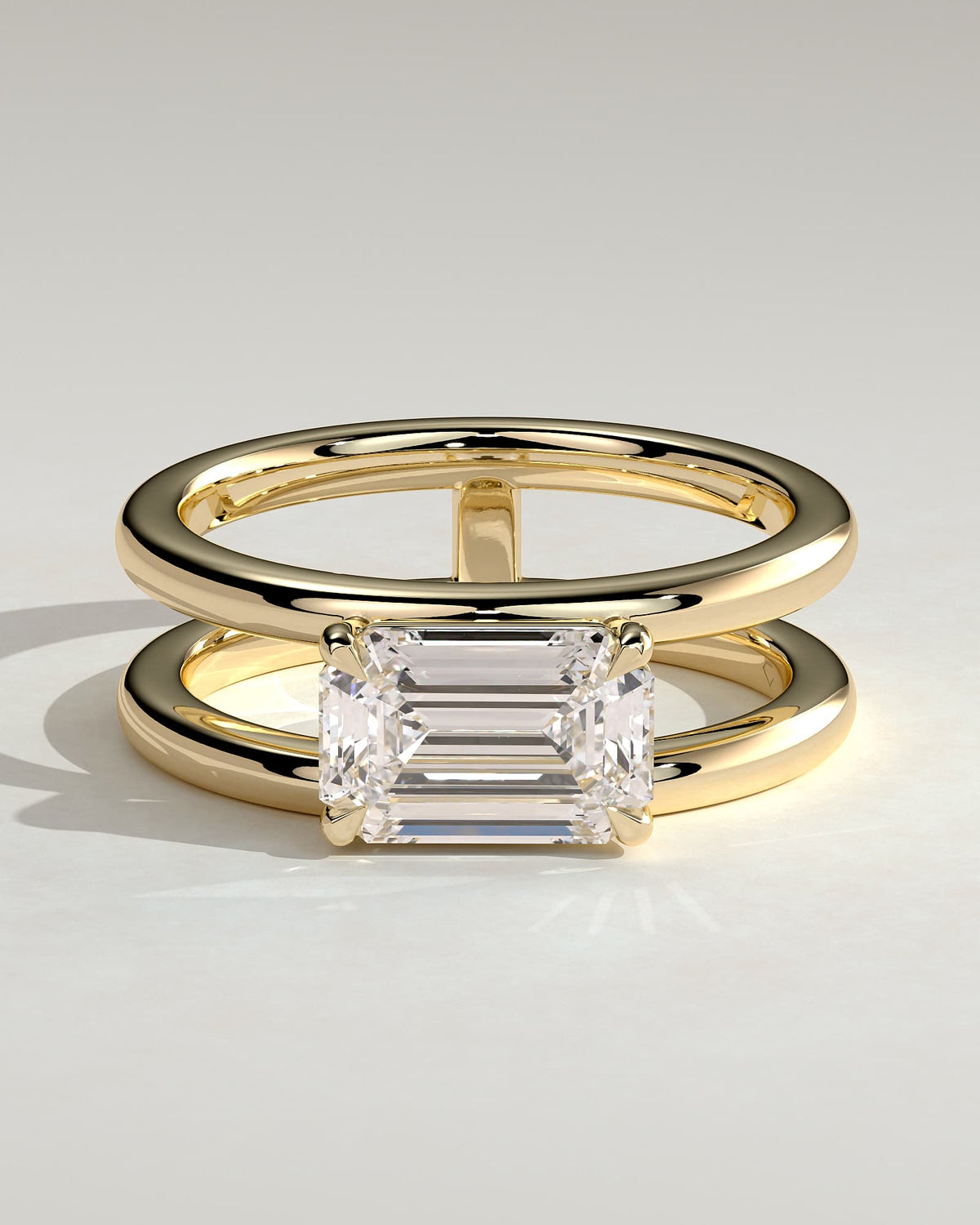 Devon - Emerald East West Claw Solitaire with Spaced Double Band Engagement Ring - Yellow Gold
