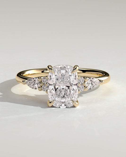 Sadie - Elongated Cushion Claw Solitaire with Pear Accents and Round Shoulder Stones Engagement Ring - Yellow Gold