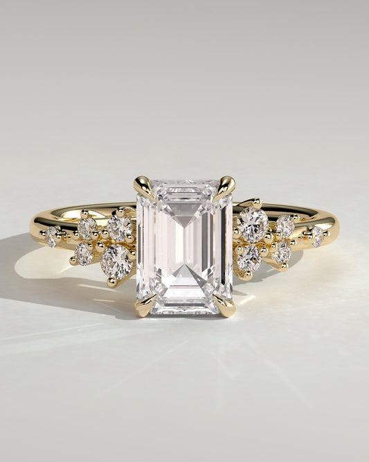 Nellie - Emerald Claw Solitaire with Clustered Round Shoulder Stones Engagement Ring - Yellow Gold