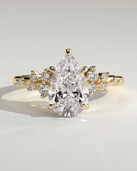 Polly - Pear Claw Solitaire with Clustered Round Shoulder Stones Engagement Ring - Yellow Gold