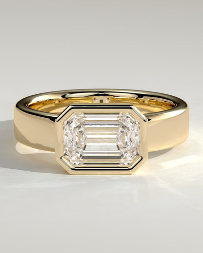 Adrian - Statement Emerald East West Bezel Solitaire with Flat Cigar Band Engagement Ring - Yellow Gold