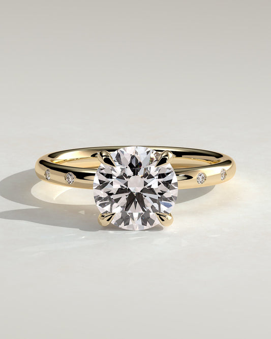 Nekija - Round Claw Solitaire with Inset Round Accent Stones Engagement Ring - Yellow Gold