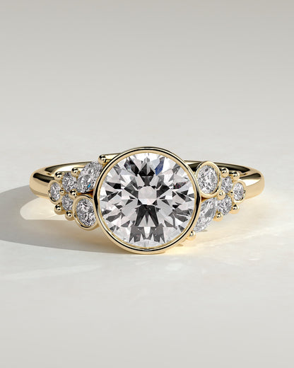 Alessia - Round Bezel Solitaire with Clustered Round-Marquise Mixed Set Shoulder Stones Engagement Ring - Yellow Gold