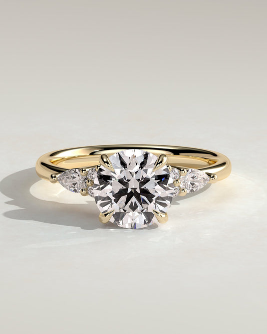 Maggie - Round Claw Solitaire with Pear Accents and Round Shoulder Stones Engagement Ring - Yellow Gold