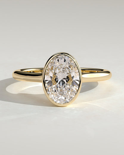 Gemma - Oval Bezel Solitaire with Twisted Gallery Engagement Ring - Yellow Gold