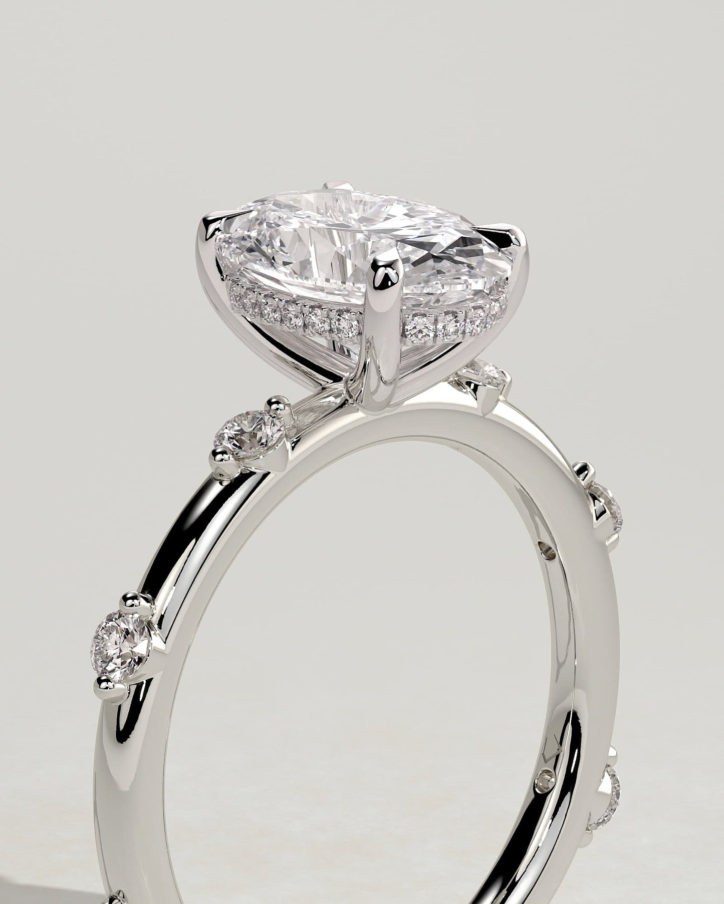 Elise - Oval Claw Solitaire with 6 Spaced Round Accent Stones and Hidden Halo Engagement Ring - White Gold