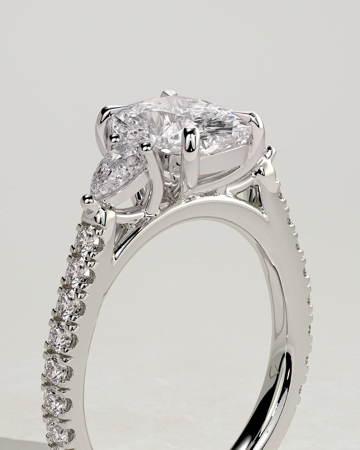 Bree - Elongated Cushion Claw Trilogy with Pear Side Stones and Pave Band Engagement Ring - White Gold