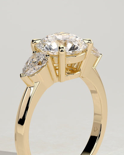 Halle - Round Claw Trilogy with Pear Side Stones and Knife Edge Band Engagement Ring - Yellow Gold