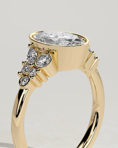 Isabella - Oval Bezel Solitaire with Clustered Round-Marquise Mixed Set Shoulder Stones Engagement Ring - Yellow Gold