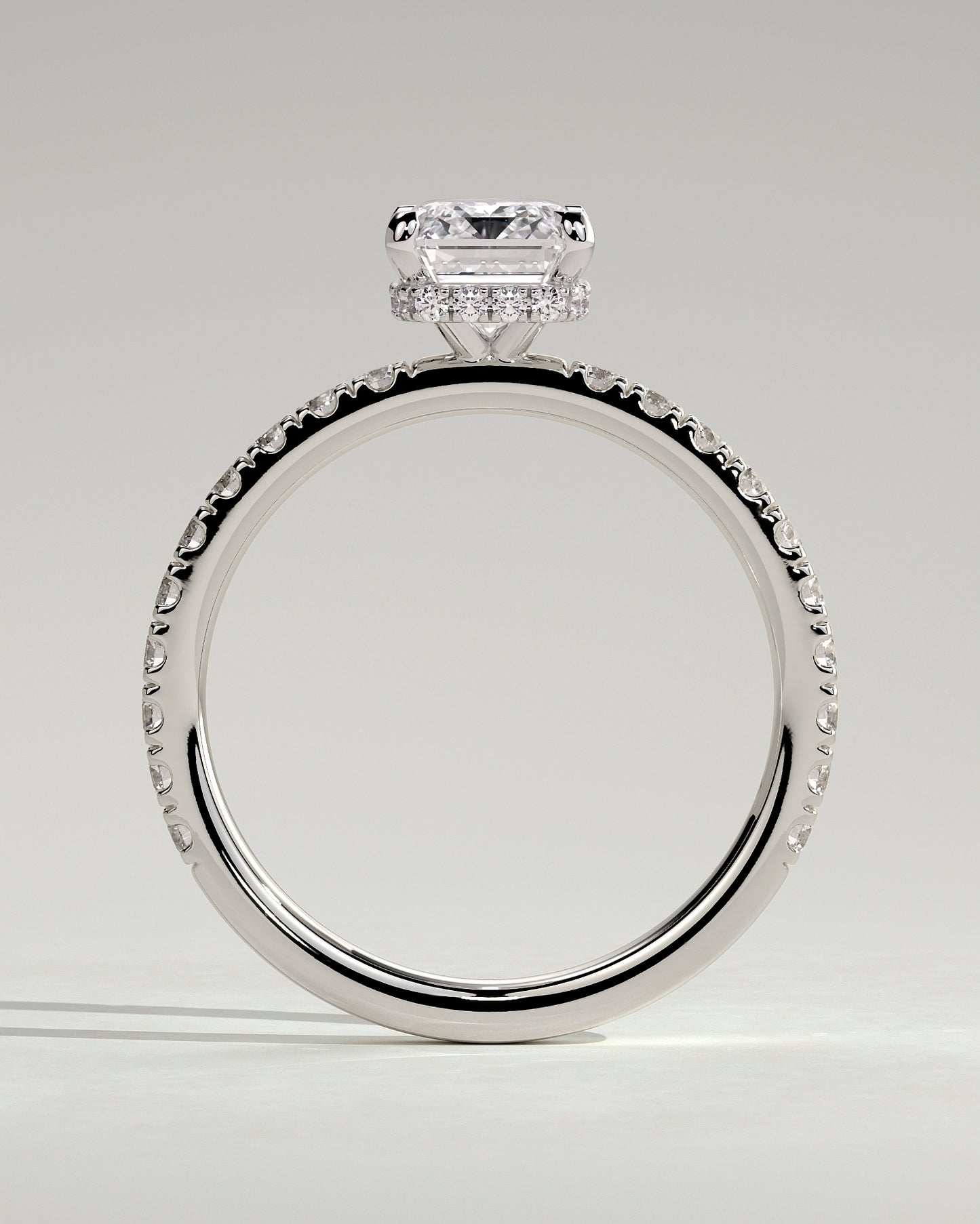 Eliana - Emerald Claw Solitaire with Wrap Around Hidden Halo and Pave Band Engagement Ring - Platinum - White Gold / Platinum 2ct