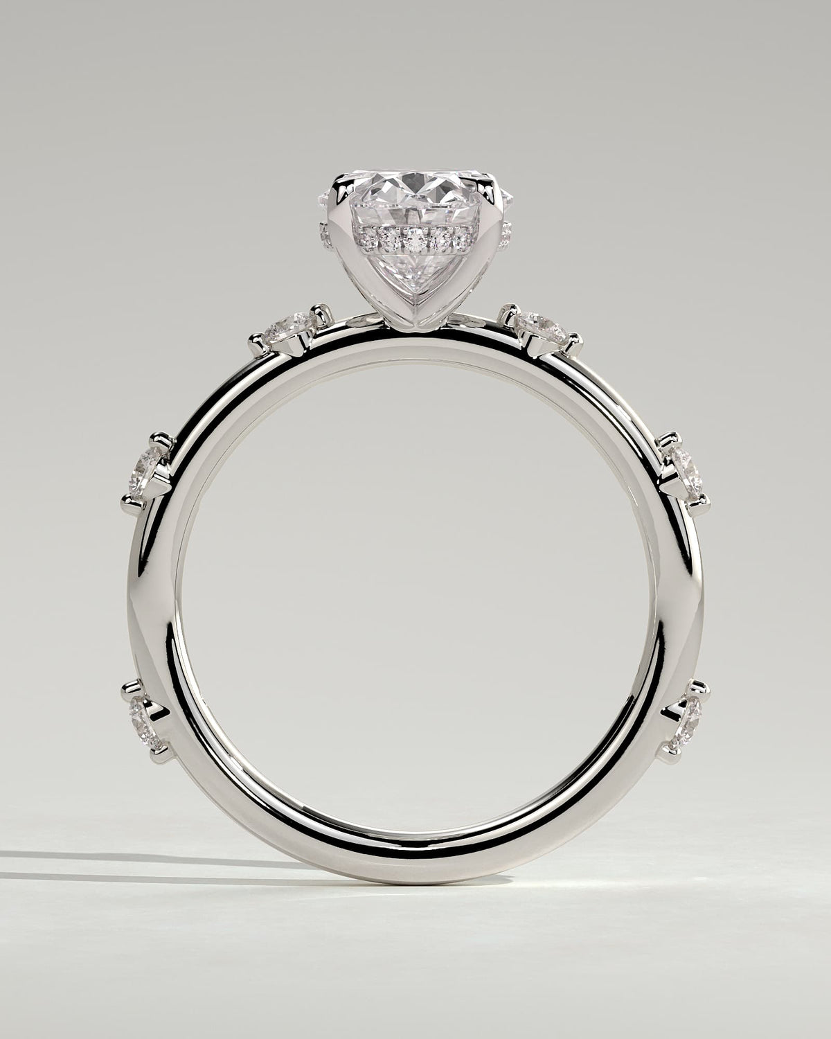 Elise - Oval Claw Solitaire with 6 Spaced Round Accent Stones and Hidden Halo Engagement Ring - White Gold