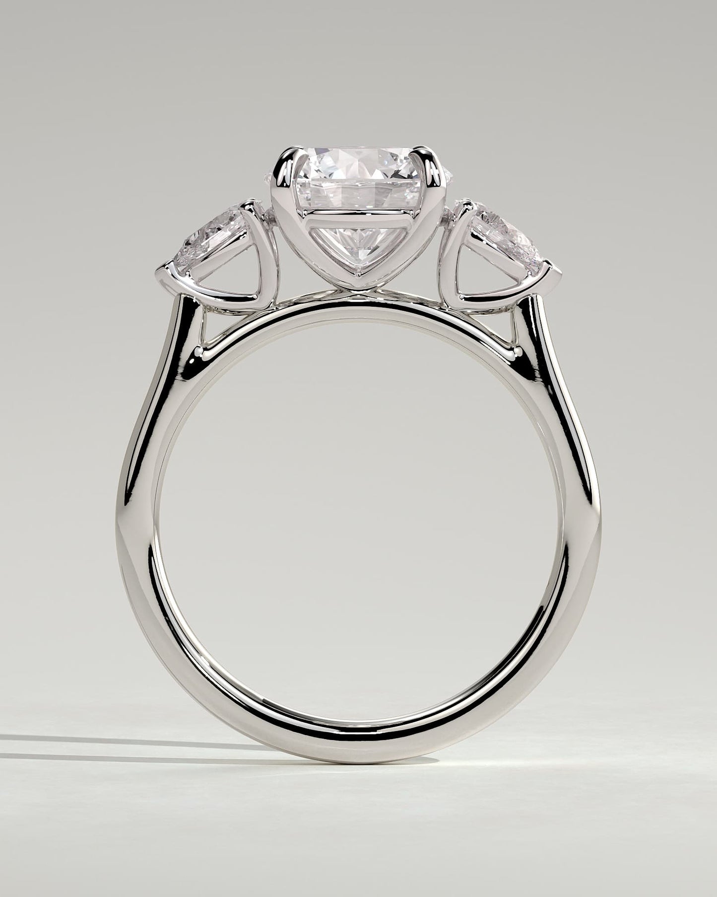 Arya - Round Claw Trilogy with Pear Side Stones and Cathedral Setting Engagement Ring - White Gold