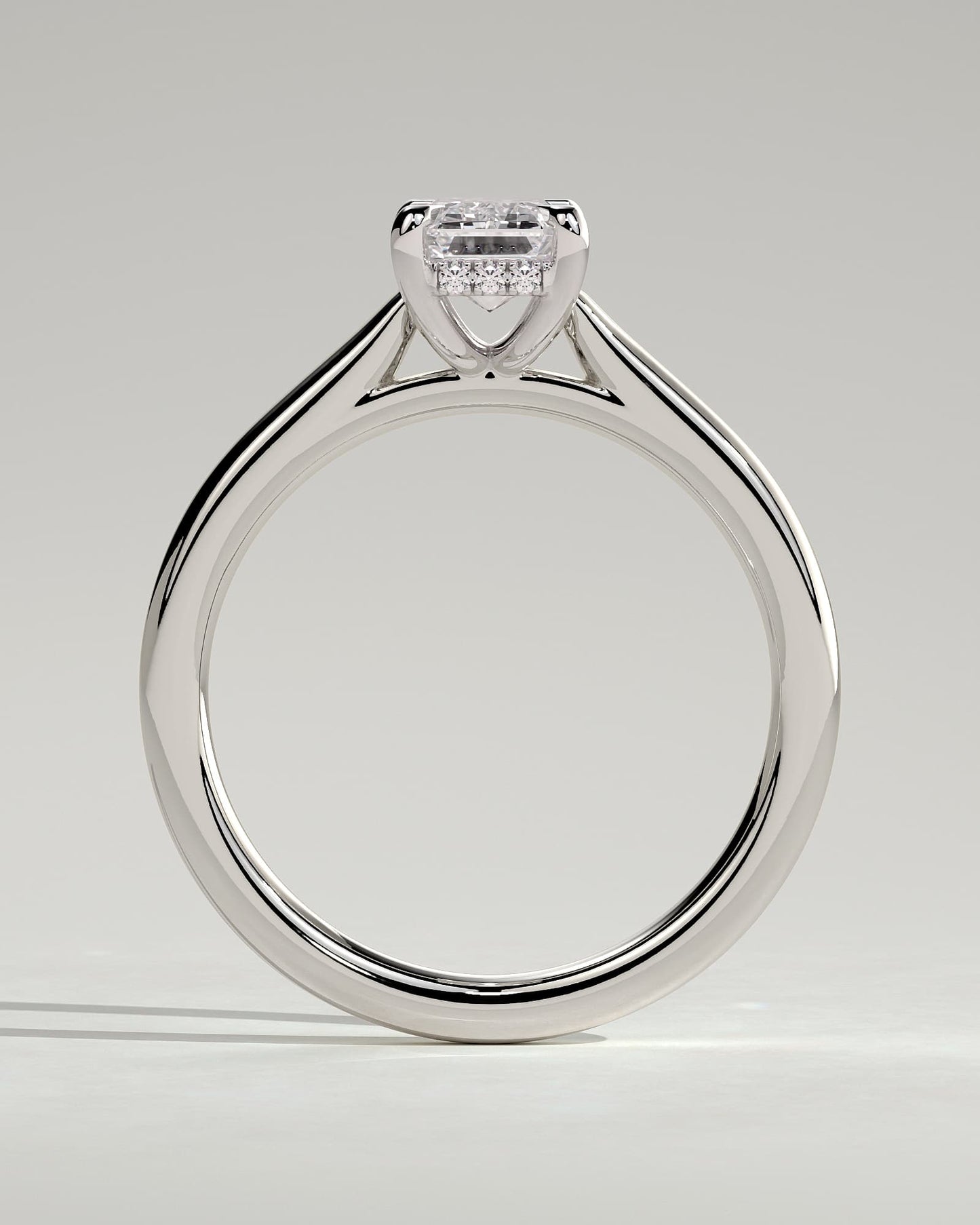 Jane - Emerald Claw Solitaire with Hidden Halo and Cathedral High Setting Engagement Ring - Platinum