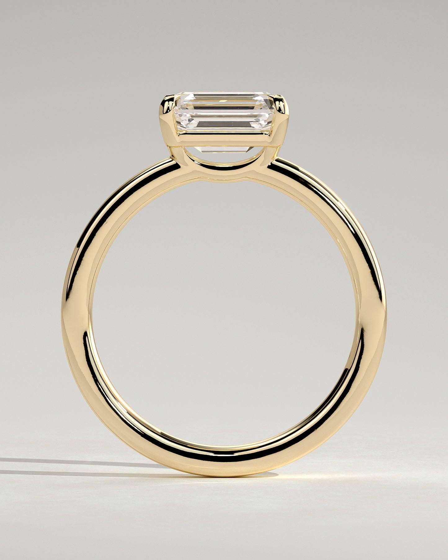 Evelyn - Emerald East West Claw Solitaire with Raised Basket Gallery Engagement Ring - Yellow Gold - Yellow Gold 2ct