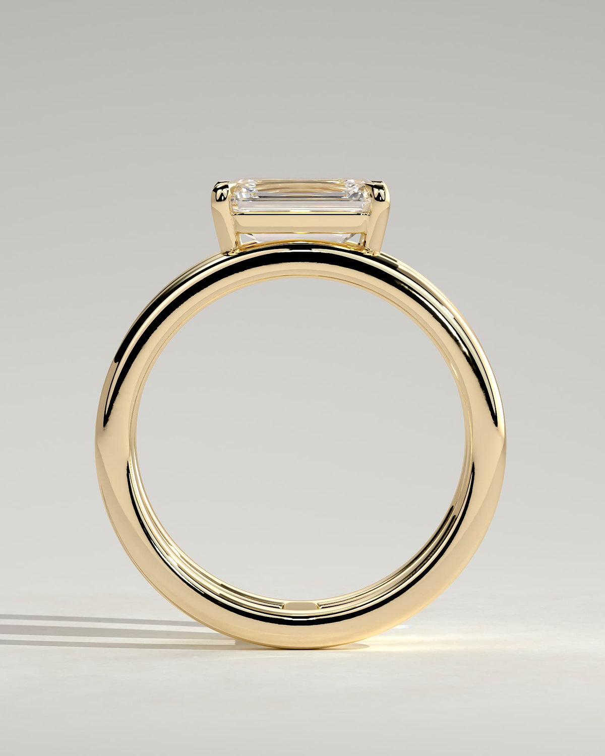 Devon - Emerald East West Claw Solitaire with Spaced Double Band Engagement Ring - Yellow Gold