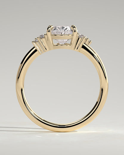 Esther - Oval Claw Solitaire with Clustered Round Opposing Shoulder Stones Engagement Ring - Yellow Gold