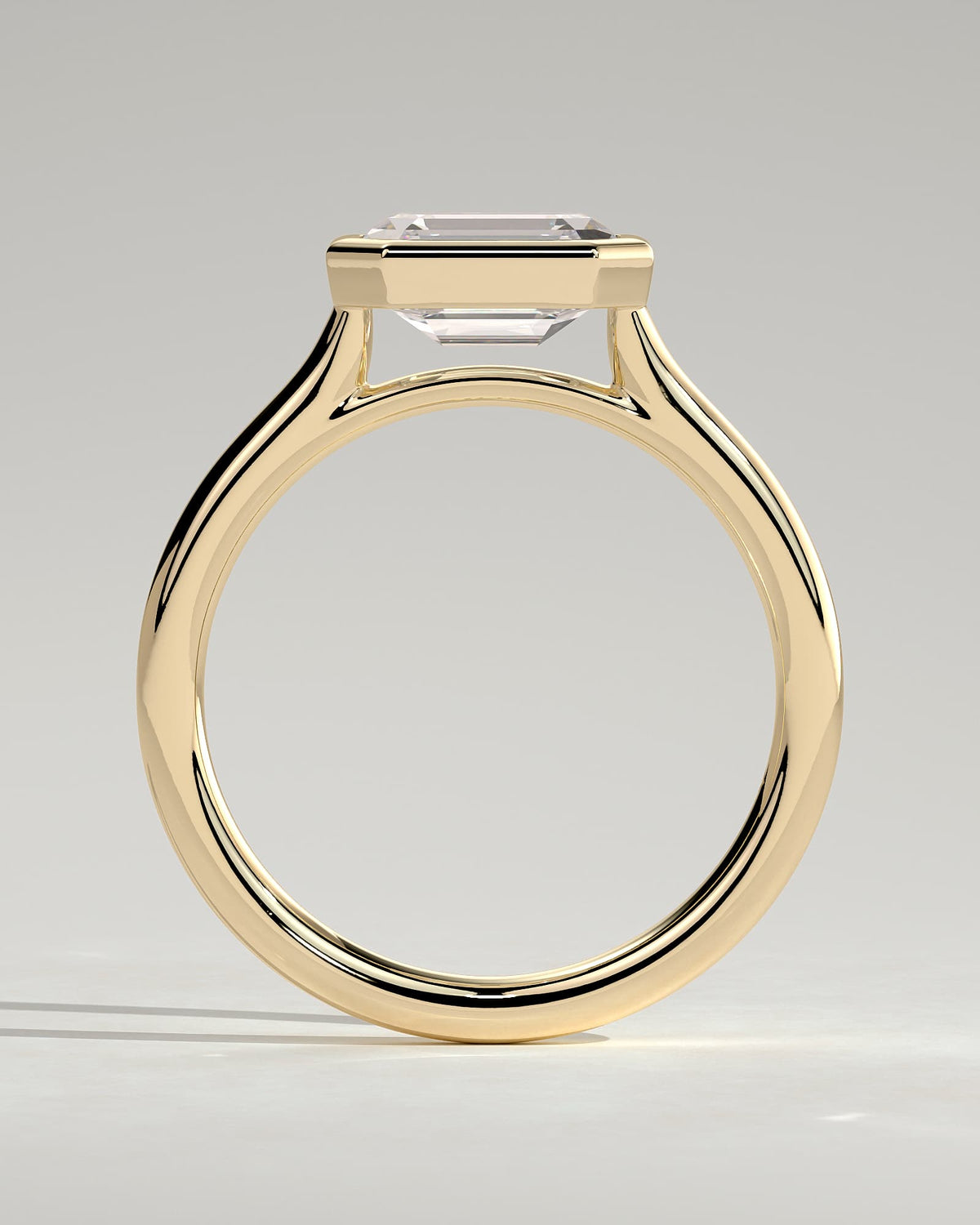 Olive - Statement Emerald East West Bezel Solitaire with Open Cathedral High Setting Engagement Ring - Yellow Gold