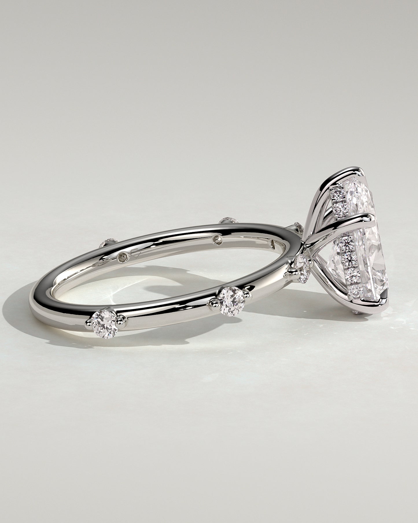Amora - Pear Claw Solitaire with 6 Spaced Round Accent Stones and Hidden Halo Engagement Ring - Platinum - White Gold / Platinum 2ct