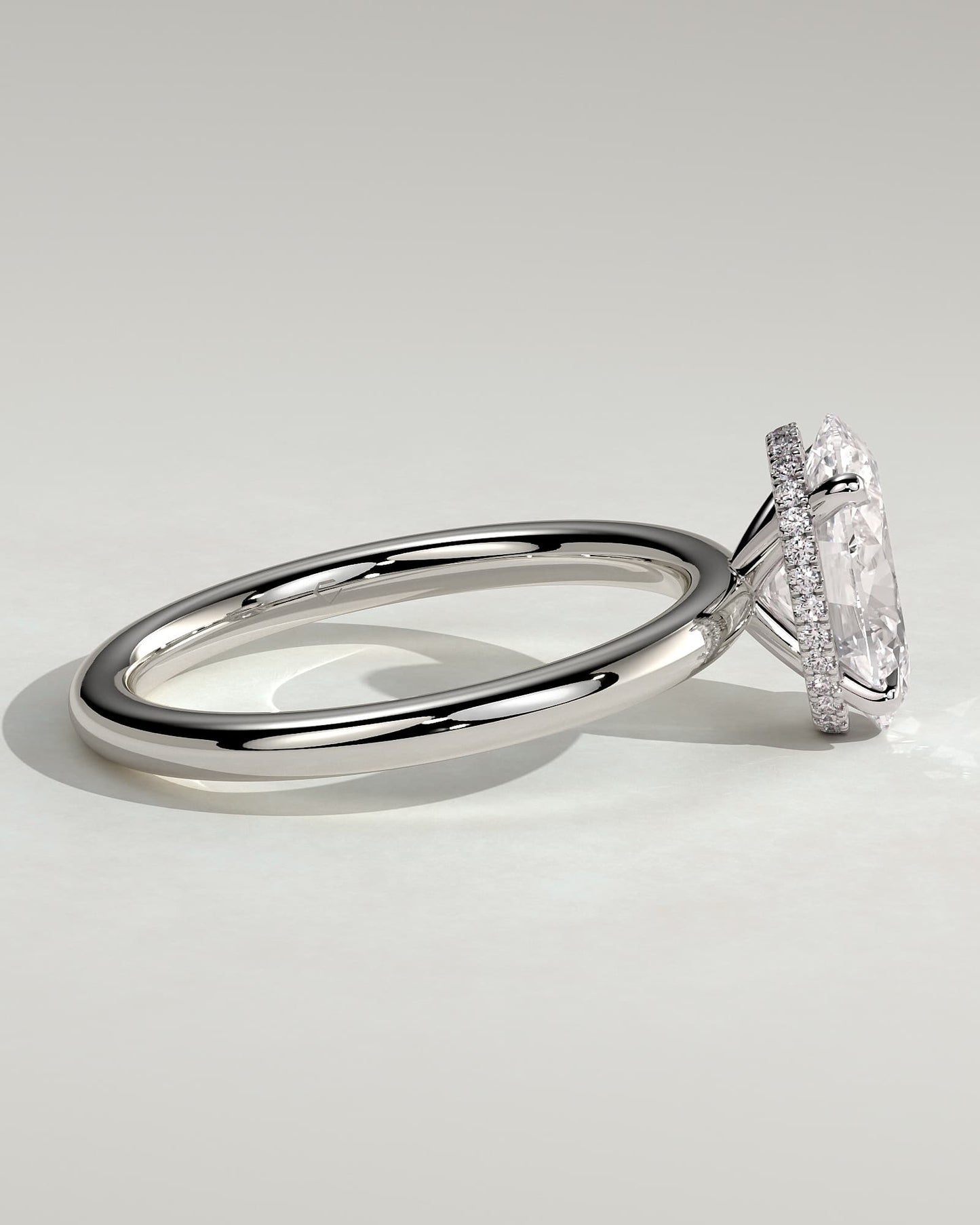 Cecilia - Oval Claw Solitaire with Wrap Around Hidden Halo Engagement Ring - White Gold