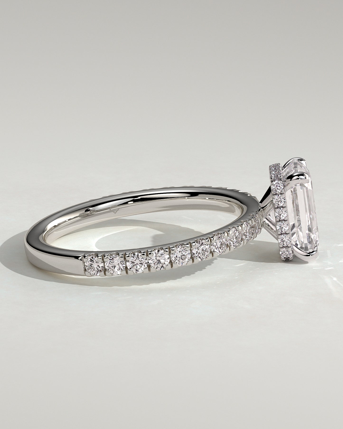 Eliana - Emerald Claw Solitaire with Wrap Around Hidden Halo and Pave Band Engagement Ring - Platinum - White Gold / Platinum 2ct