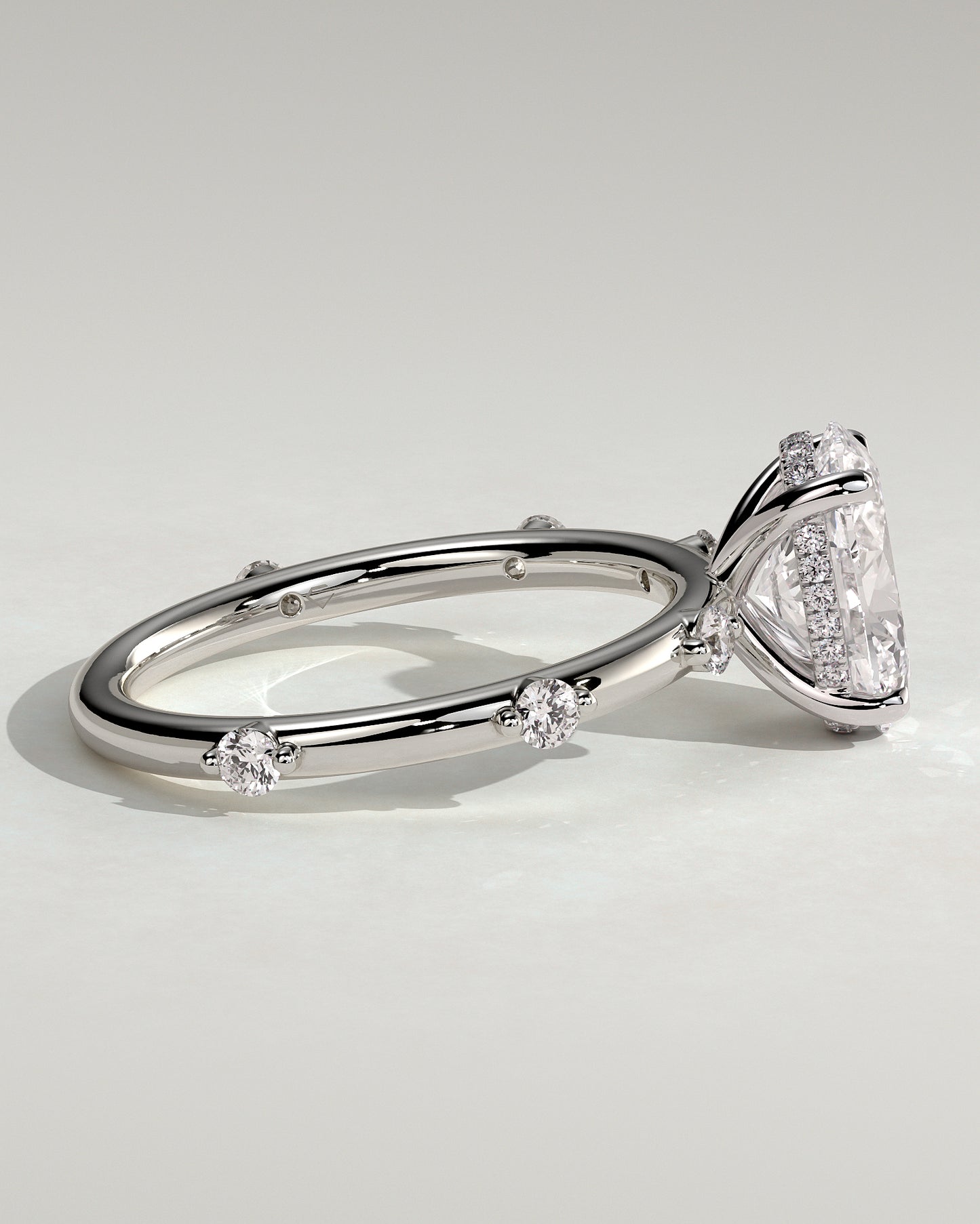 Elise - Oval Claw Solitaire with 6 Spaced Round Accent Stones and Hidden Halo Engagement Ring - Platinum - White Gold / Platinum 2ct