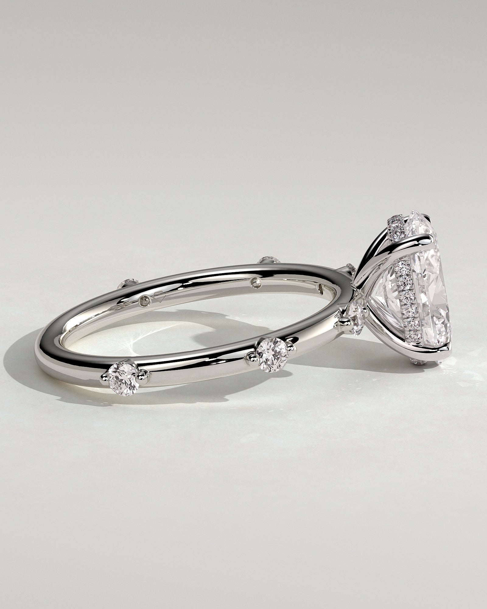 Elise - Oval Claw Solitaire with 6 Spaced Round Accent Stones and Hidden Halo Engagement Ring - Platinum - White Gold / Platinum 2ct