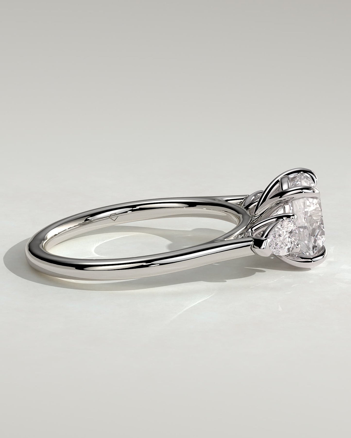 Arya - Round Claw Trilogy with Pear Side Stones and Cathedral Setting Engagement Ring - White Gold